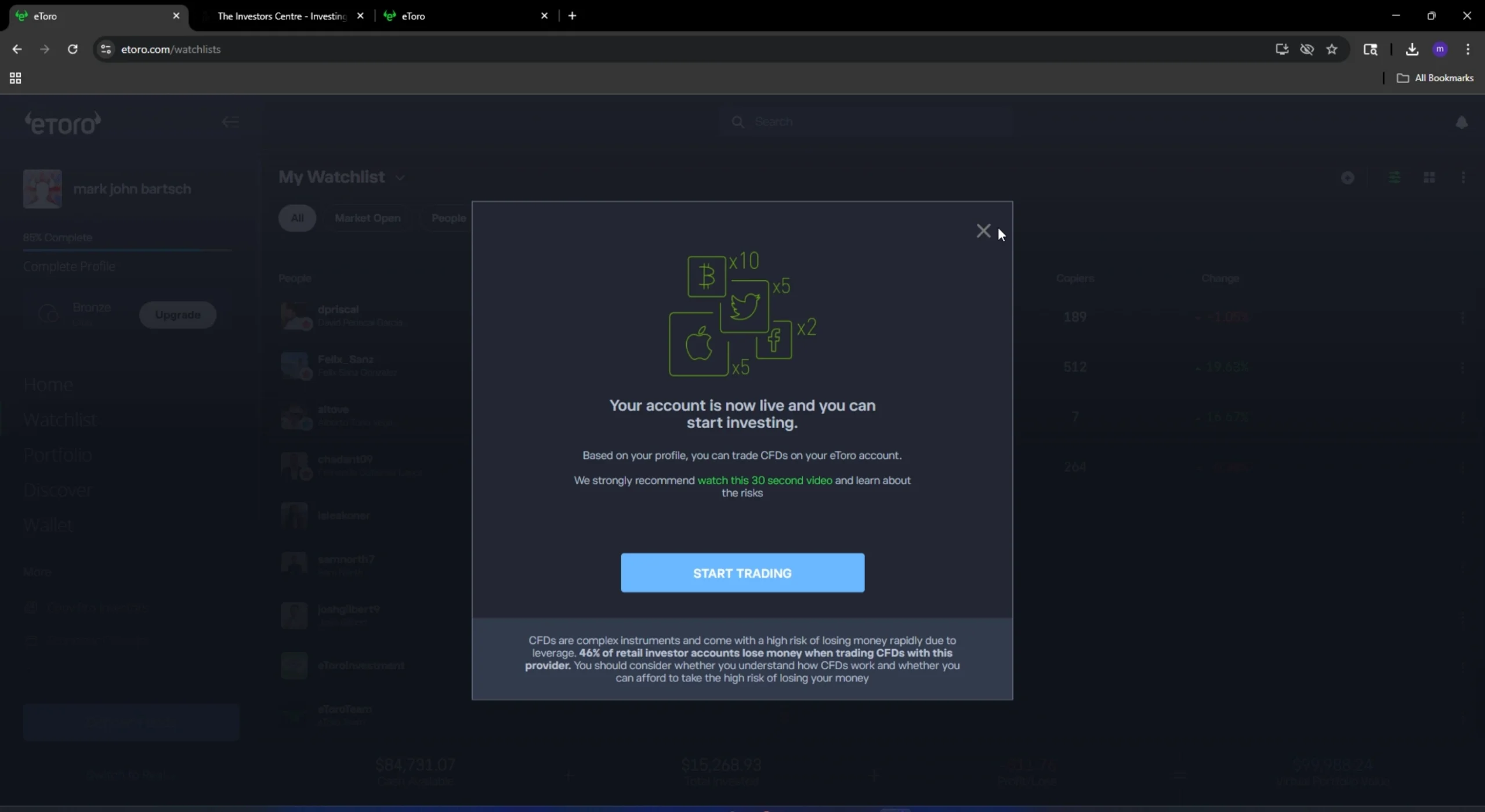 eToro account verification confirmation dialog showing 'Your account is now live and you can start investing' with a Start Trading button and CFD risk warning